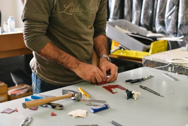 A man at the working table with his equipments