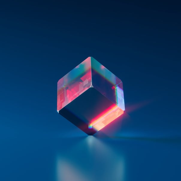 A transparent cube balanced on a surface with one of its corners