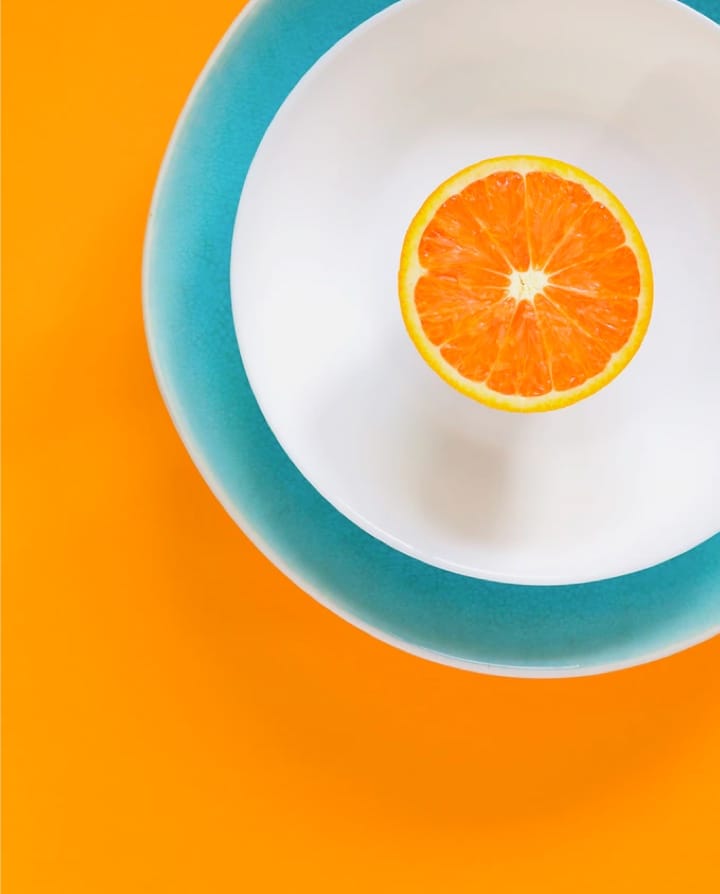 Portrait of orange in a plate